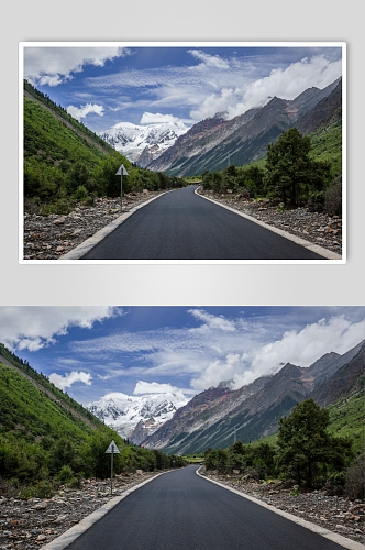 西藏高原群山中的公路摄影图片