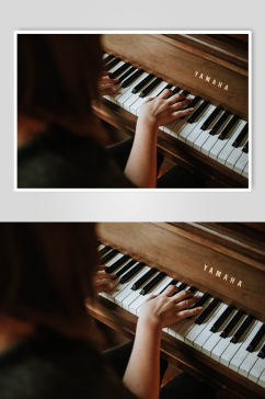 弹钢琴实拍摄影图